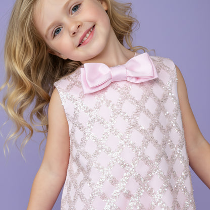 Roze meisjesfeestjurk met glinsterende pailletten, satijnen strik en zachte tule lagen