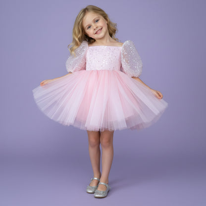 Roze meisjesfeestjurk met pofmouwen, satijnen strik en tule rok