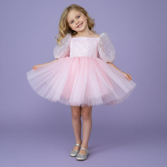 Roze meisjesfeestjurk met pofmouwen, satijnen strik en tule rok